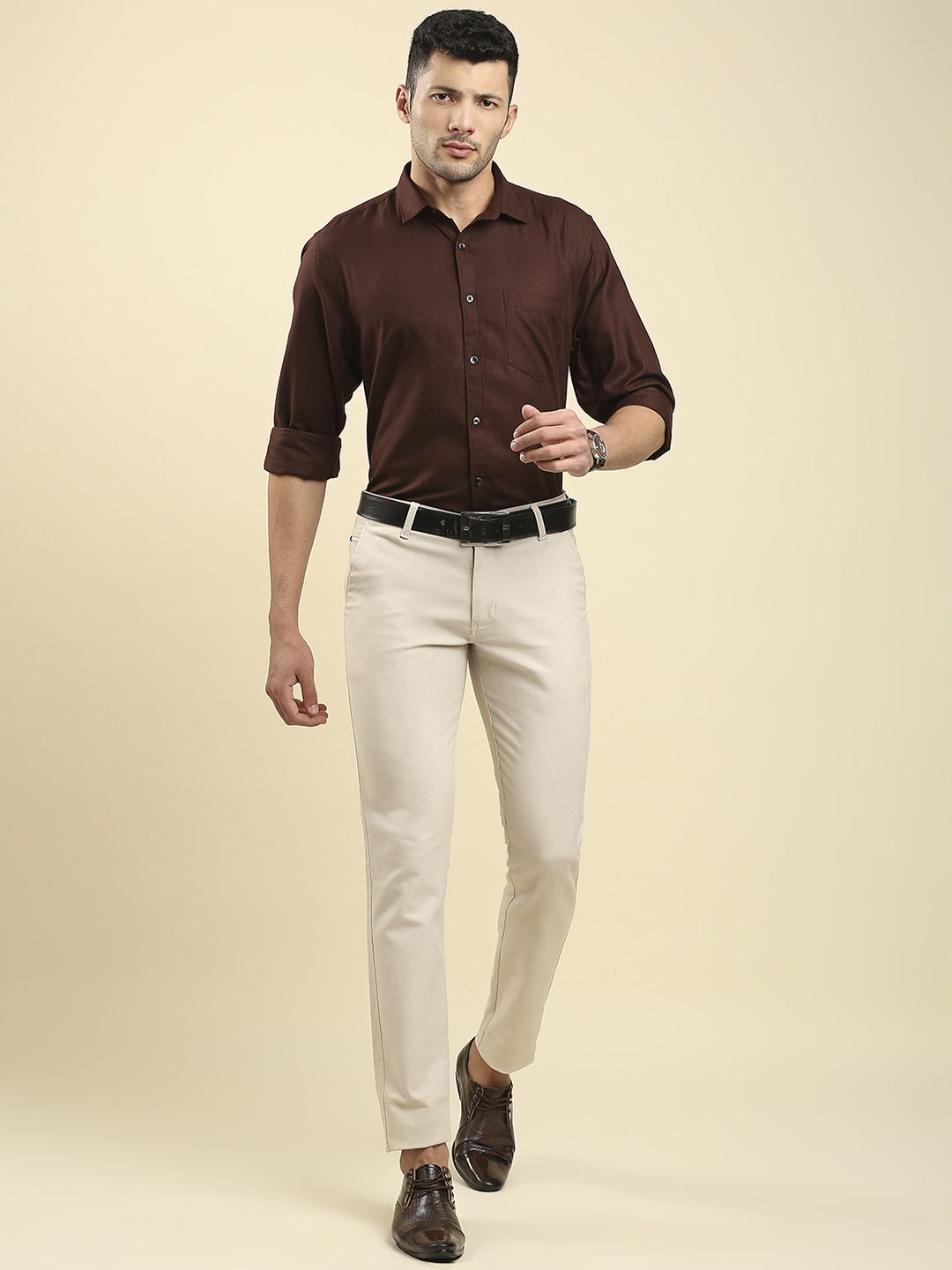 A Man in Brown Shirt and White Pants  Free Stock Photo